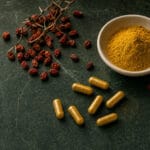 Berberine Complete Guide 2026: Dosage, Benefits & Comparison to Metformin Golden berberine capsules with dried barberry berries and yellow powder